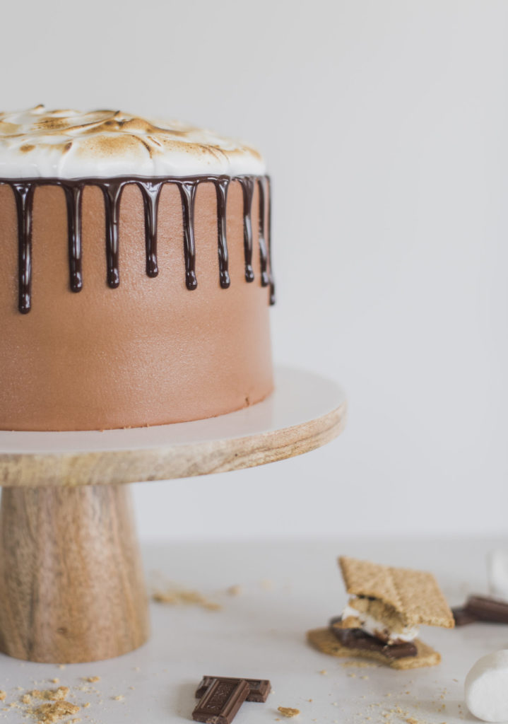 Ultimate S'mores Cake - Get ready for THE PERFECT summer cake! My dark chocolate cake layers are baked on a graham cracker crust, topped with chocolate ganache toasted marshmallow filling, chocolate buttercream and a toasted homemade marshmallow fluff. It doesn't get more ultimate than this! #cakebycourtney #ultimatesmorescake #chocolatecake #smores #smorescake #smorescakerecipe #smoresdessert #summerdessert #chocolate buttercream #summerrecipes #bestchocolatecakerecipe #bestchocolatecake #thebestchocolatebuttercream