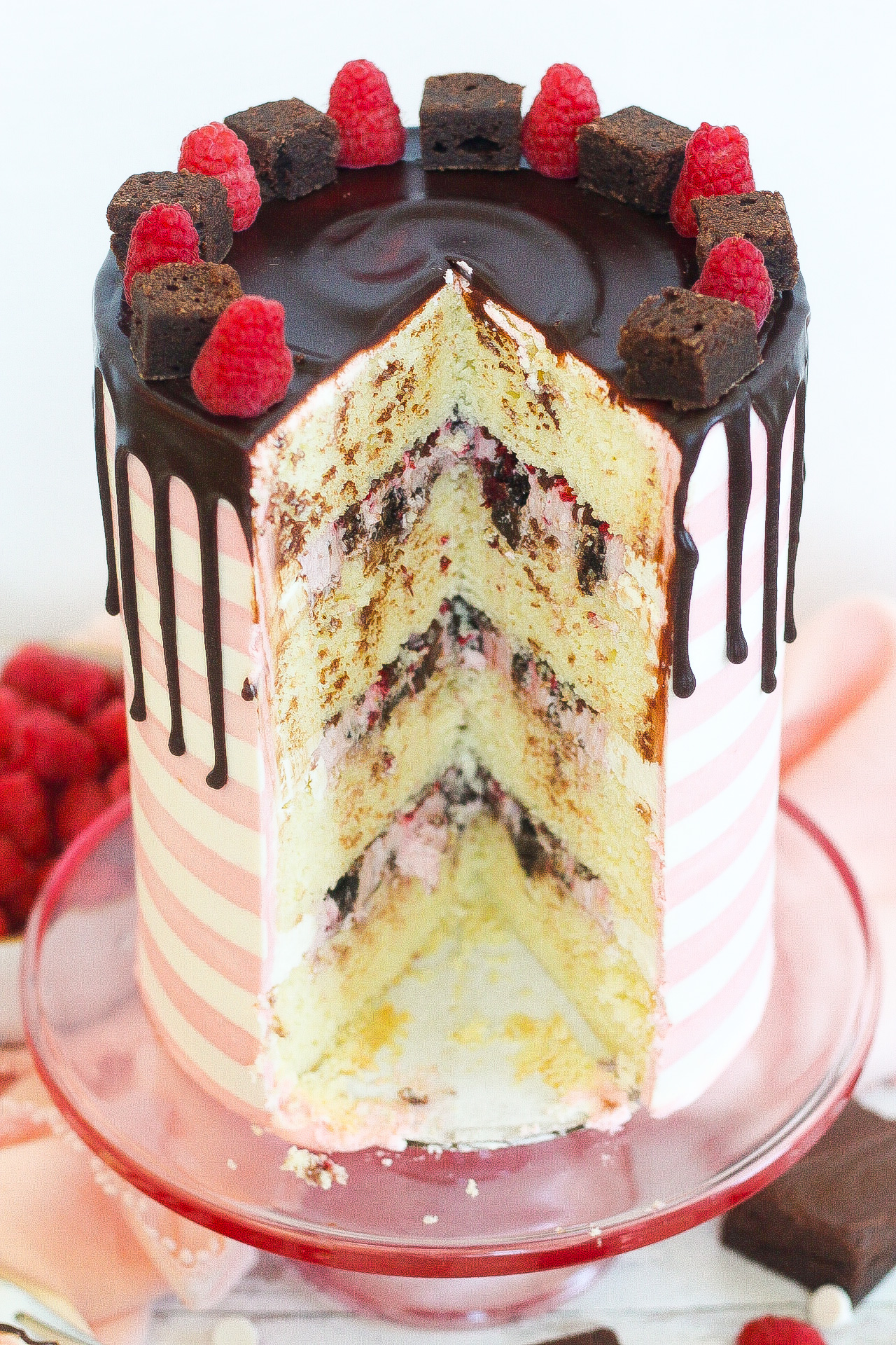 Six inch, four-layer cake with a slice cut out. 