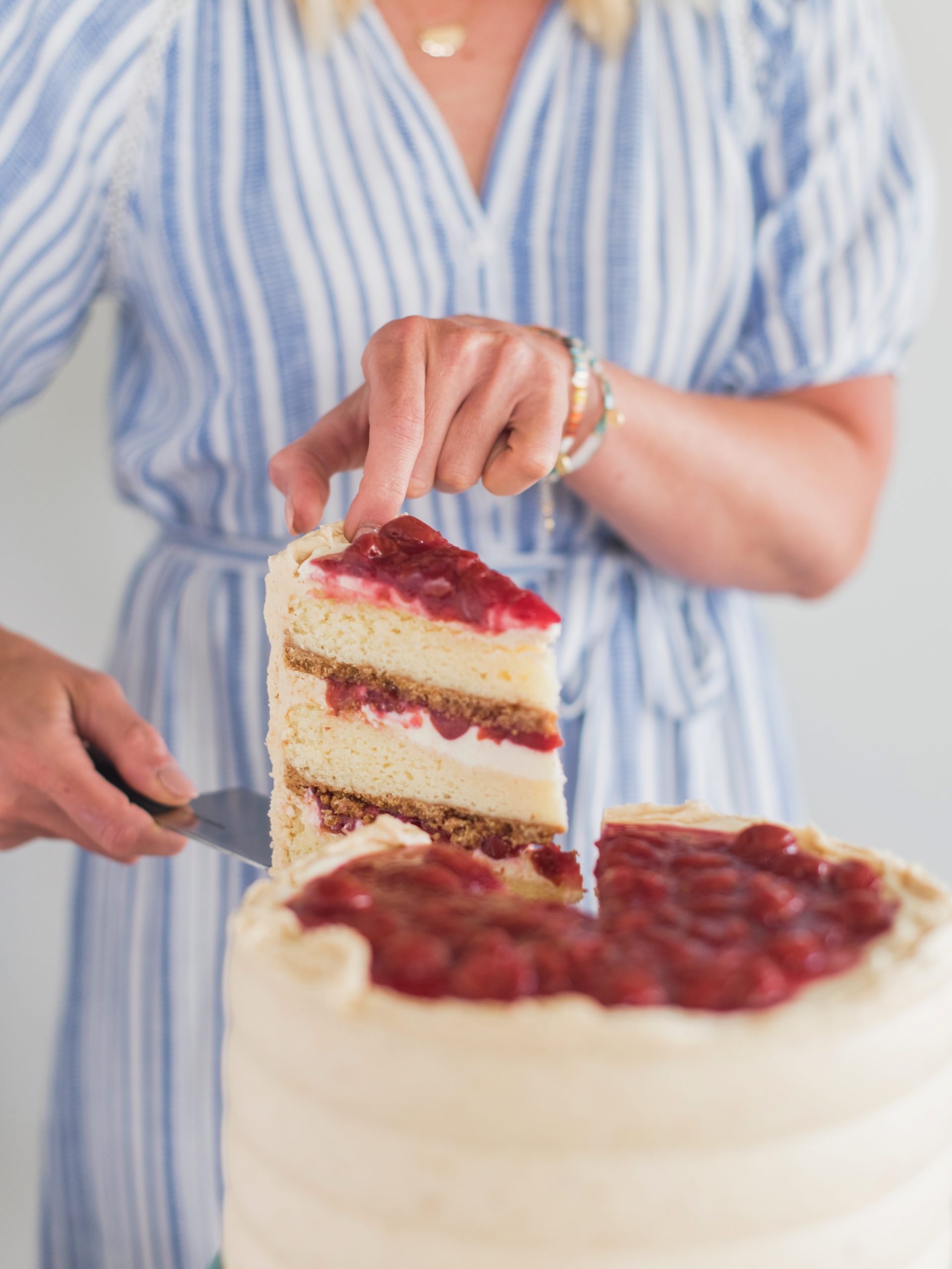 Taking a slice out of a cake.