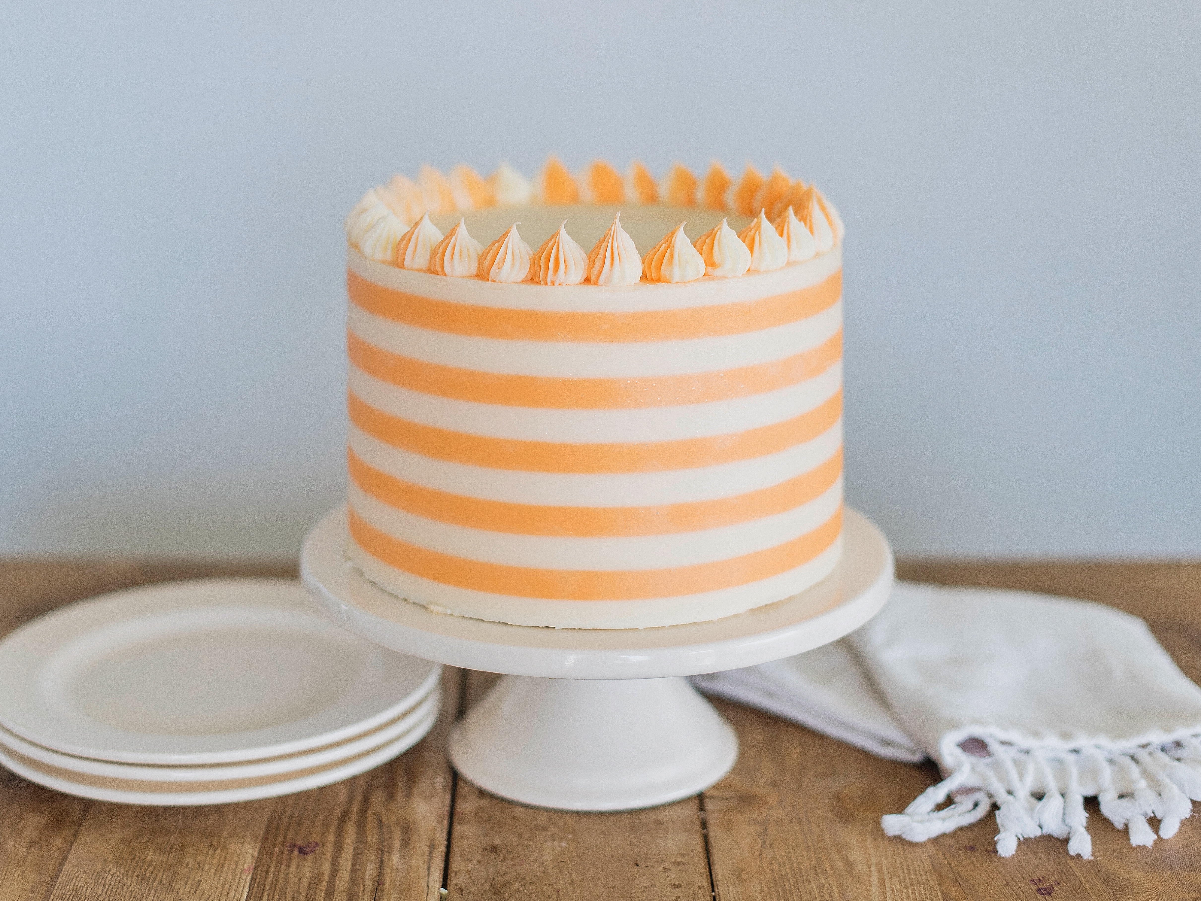 Creamsicle Cake: orange cream cake layers, filling and buttercream #cakebycourtney #cake #creamsiclecake #creamsicle #orangecreamcake #cakerecipe #summercakerecipe