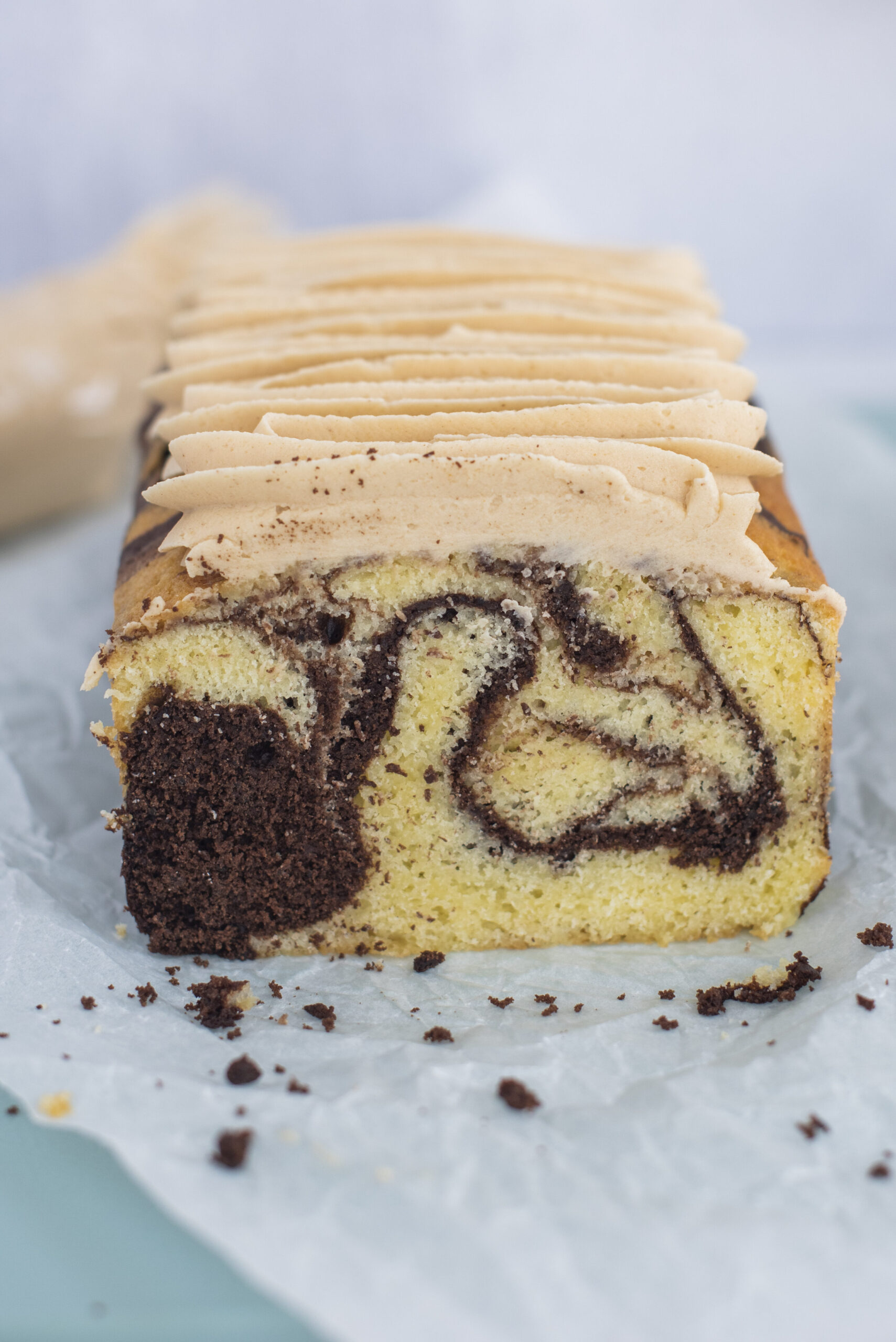 Marble loaf cake on parchment paper.